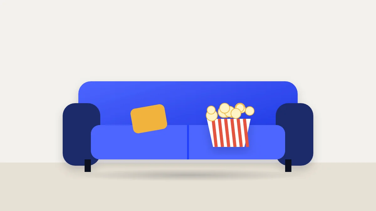 Blue sofa with a cushion and a striped popcorn box